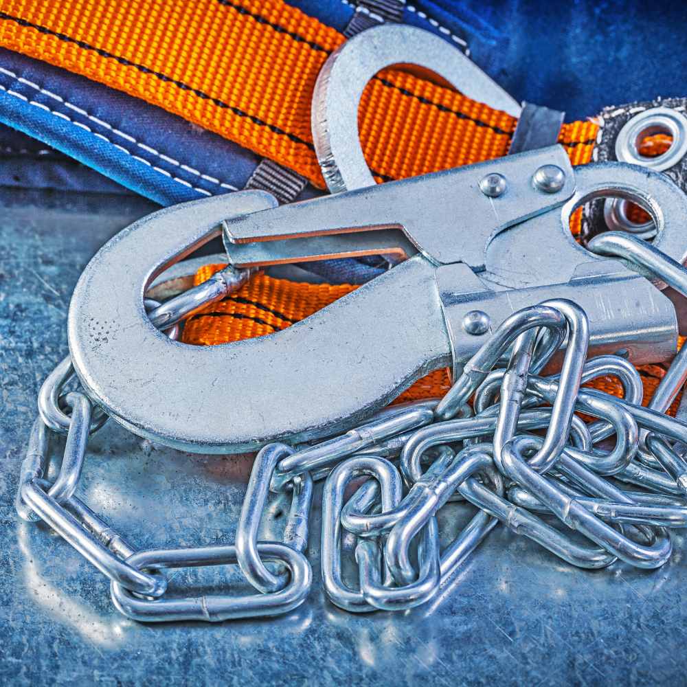 A five point full body safety harness laid out flat